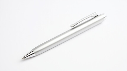 A sleek silver pen lying on a clean white surface, perfect for office settings. isolated on white background.