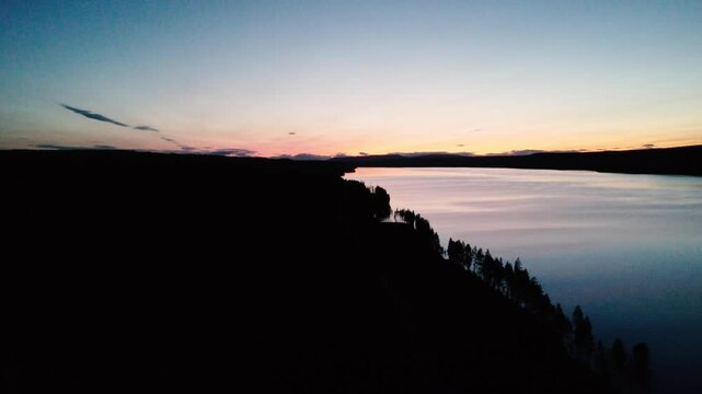 Scenic Drone Footage of Jokkmokk&rsquo;s Wilderness &ndash; Lake, Forest & Mountains Sunset