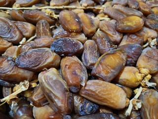 Dried dates in a box. Texture of dates