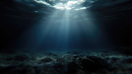 Sunlight piercing dark underwater scene.  Deep ocean floor