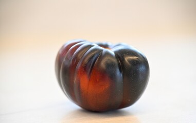 High resolution close up studio image of a beautiful fresh, organic tomato