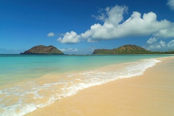 A beach with waves, sand, and a blue sky with clouds