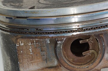 Used piston close up from the side