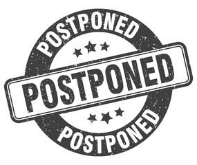 postponed stamp. postponed label. round grunge sign