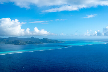 Aerial view of Tahaa island, French Polynesia, with turquoise lagoon and reef