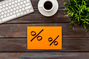 Sales concept. Online shopping - table with computer and discount sing, top view
