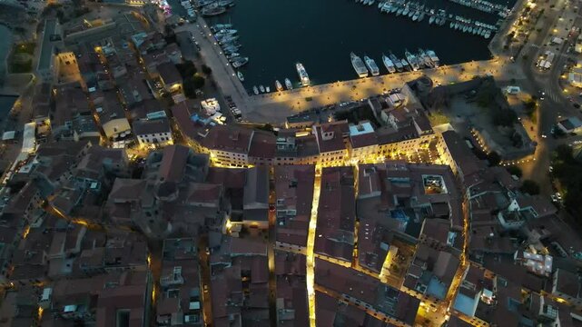 Nocturnal aerial views of the town of Alghero in Sardinia 