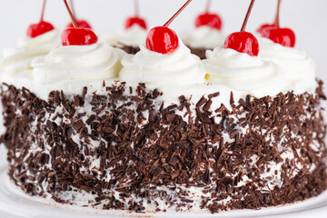 Black forest cake, Schwarzwald pie with dark chocolate and cherry, closeup. Vegan food, sugar, lactose and gluten free.