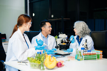 Team of scientists examining food samples in a lab with microscopes. Perfect for themes of food science, biotechnology,