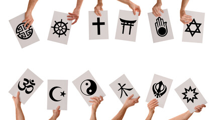 Hands holding signs with symbols of various world religions isolated