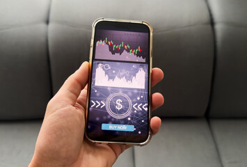 Businessmen work with stock market investments using smartphone to analyze trading data. smartphone with stock exchange graph on screen. Financial stock market.