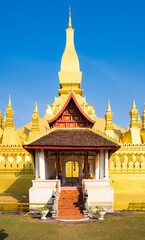 Fototapeta premium Golden Pha That Luang temple in Vientiane, Laos during sunset