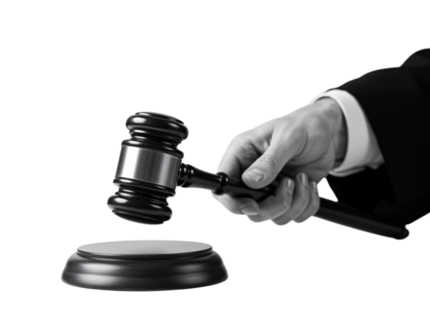 A black gavel held by a hand in a suit, against a transparent background