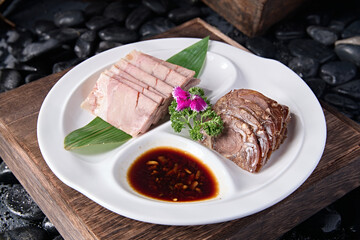 Delicious cold dish with dipping sauce and pressed pork elbow