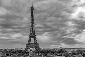 Panoramic view of the Eiffel Tower area of ​​Paris, France, under a dramatic sky, in black and white