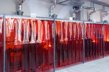 Vibrant Red Drapes Create a Captivating Atmosphere in a Modern Industrial Setting