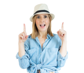 Portrait of a happy young woman dressed in denim shirt pointing fingers up at copy space isolated over transparent background. PNG transparent.