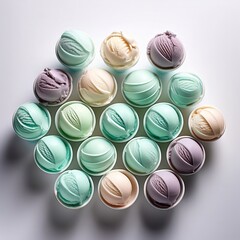 Obraz premium Colorful variety of ice cream scoops arranged neatly on a surface in natural light