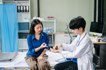 Doctor examining patient with symptoms in a clinic. Medical consultation and healthcare interaction.