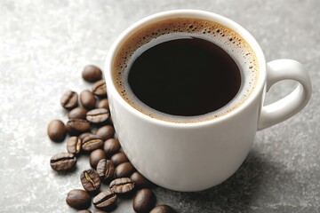 Obraz premium A white coffee cup filled with dark coffee beans around it