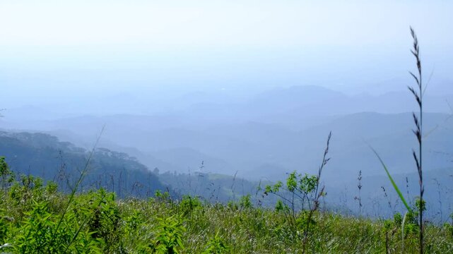 Scenic view of rugged mountainous environment in hazy foggy weather in Haputale highlands of Sri Lanka
