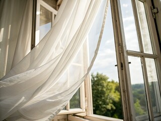 Soft light illuminates billowing white curtains, a peaceful home scene captured in close-up.