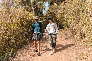Hiking Couple Activity climbing on mountain backpack travel and adventure, Travel lifestyle in nature.