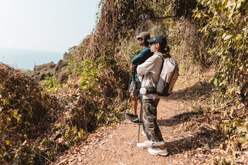 Naklejka premium Hiking Couple Activity climbing on mountain backpack travel and adventure, Travel lifestyle in nature.