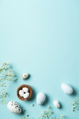 Easter background with eggs, decorations and flowers.