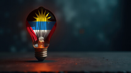 A patriotic concept: A light bulb with the Antigua and Barbuda flag design glowing in the dark, symbolizing ingenuity, technology, and energy independence