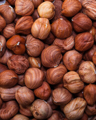 Close-up of whole hazelnuts in shell as a natural background