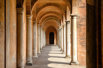 Fototapeta premium Arafed archways in a building with columns and brick floors