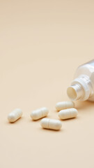 An image of a bottle with white capsules on a wooden surface.