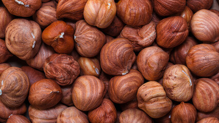 Close-up of whole hazelnuts in shell as a natural background