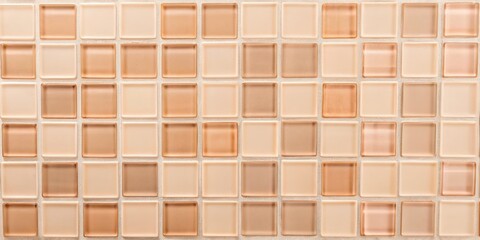 a wall of small  two-toned glass square tiles