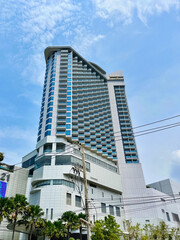 Pattaya. Tall buildings frame a clear blue sky in Pattaya, Thailand, showcasing urban life on a sunny day