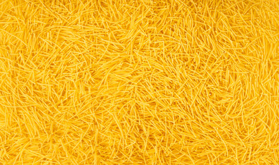 Raw vermicelli textured background, gold soup pasta pattern, small homemade noodles mock up