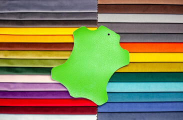 Bright samples of textiles and leather for furniture upholstery. A set of interior fabric. Collection of textile fabrics for the manufacture of upholstered furniture