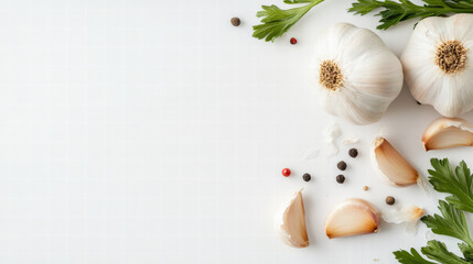Fresh garlic cloves and parsley on white background