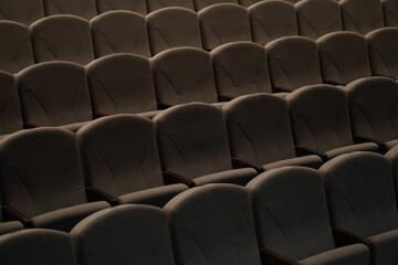 Obraz premium Chairs upholstered in gray beige textiles in the concert hall