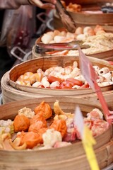 Colorful Steamed Dim Sum in Traditional Bamboo Baskets