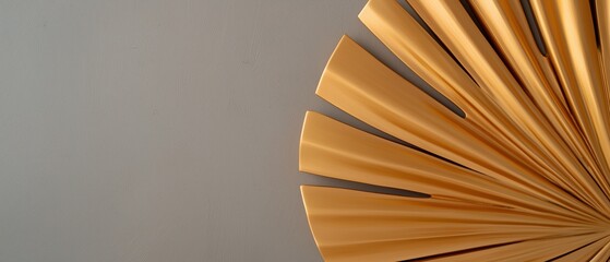 Close-up of a gold-colored object that appears to be a fan-like structure.