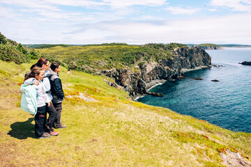 A family trekking the Skerwink Trail, newfoundland