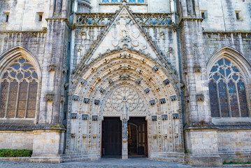 The entrance gate on the facade of the famous cathedral of Quimper, Brittany, France, in its typical gothic style.