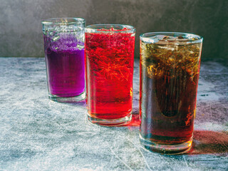 A lot of Soft drinks in colorful and flavorful glasses on the table,Glasses with sweet drinks with...