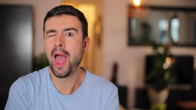 Funny man winking many times 