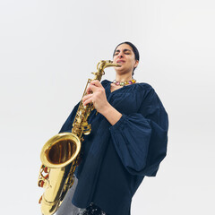 Low-angle view of female musician emotionally playing saxophone, fully lost in melody and...