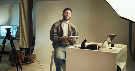 Studio, photographer and portrait of man with tablet for editing software, photoshoot and production. Happy, creative director and person with digital tech for media catalogue, photography and film