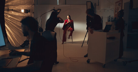 Photoshoot, photographer and group in studio, model and pictures for fashion magazine or...