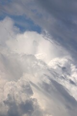 A close-up of the cloudy sky. Color background. Soft shapes. Simple composition. Abstract environment. Atmosphere of presence. Picture. Wallpaper. Poster. Postcard. Place to insert